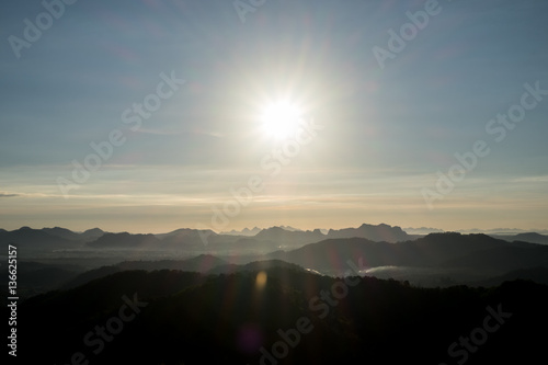 Beautiful Landscape of Sunrise with mist, sky and cloud shooting from top mountain at Phu Bo Bit, Loei, Thailand