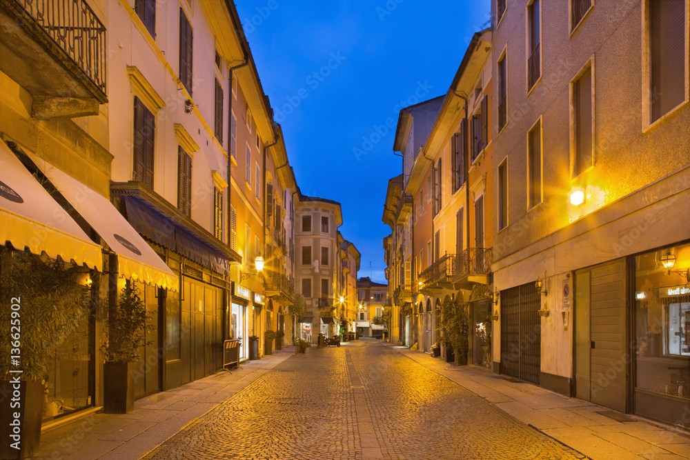 CREMONA, ITALY - MAY 24, 2016: The street of old town in morning dusk.