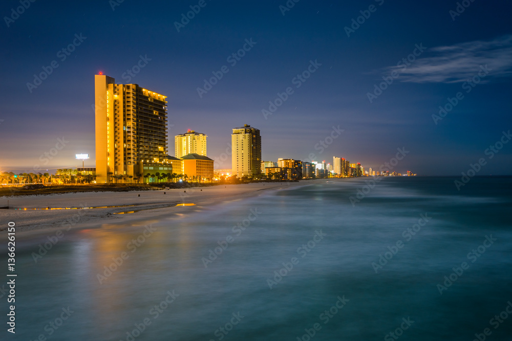 Obraz premium Highrises along the Gulf of Mexico at night, in Panama City Beac