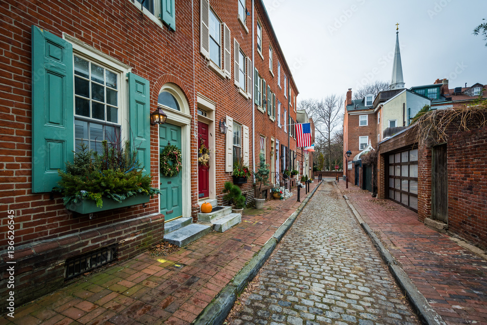 Historic brick buildings and cobblestone street in Society Hill,