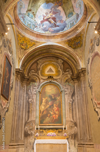 BRESCIA, ITALY - MAY 22, 2016: The the side chapel wih the painting of Holy Trinity in church in church Chiesa di San Francesco d'Assisi by Giuseppe Tortelli (1738).