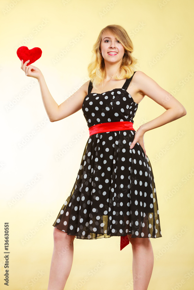 Woman holding red heart love symbol Woman holding red heart love symbol
