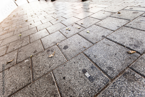 Adhesive Bandage on Pavement