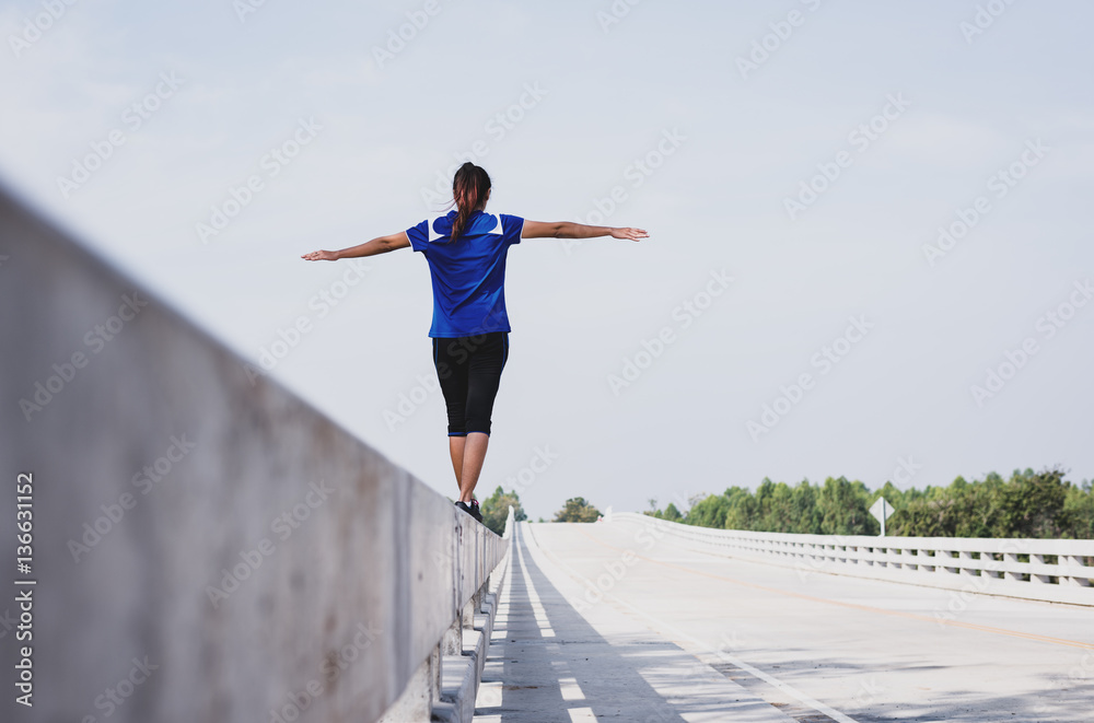 confident woman walking on bridge confident woman walking on bridge