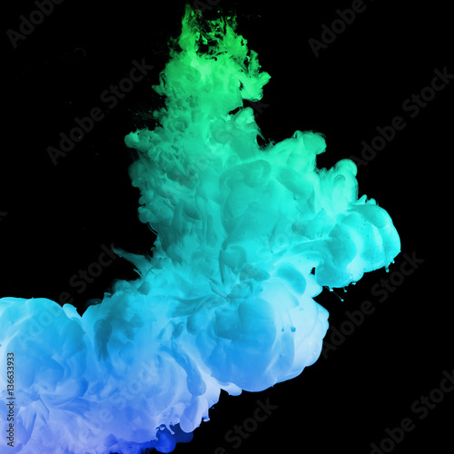 Acrylic colors and ink in water. Ink swirling in water. Ink in water isolated. Colorful ink in water. Paint splash. Abstract background.