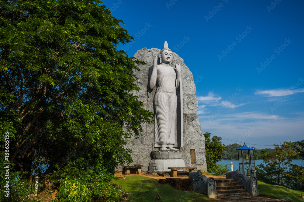 Large Buddha statue at Giritale Lake (Giritale Wewa) in North Central Province, Cultural Triangle, Sri Lanka, Asia