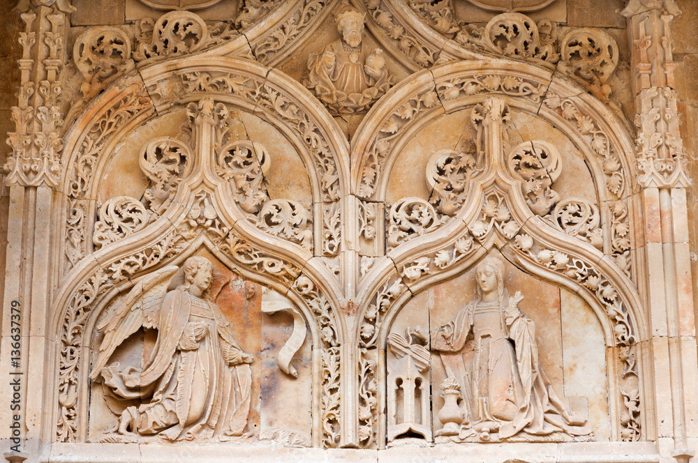 SALAMANCA, SPAIN, APRIL - 17, 2016: The Annunciation as the detail from gothic portal of romanesque church Iglesia de San Benito.