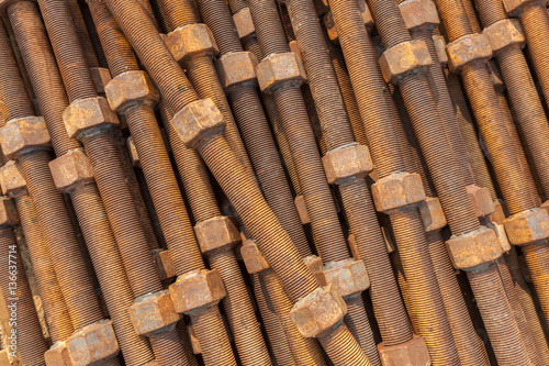 Close-up old rusty screw nuts and bolts use for industrial usage