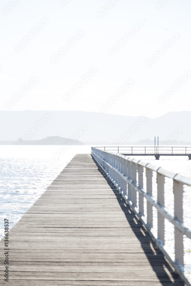 A pier on a lake A pier on a lake