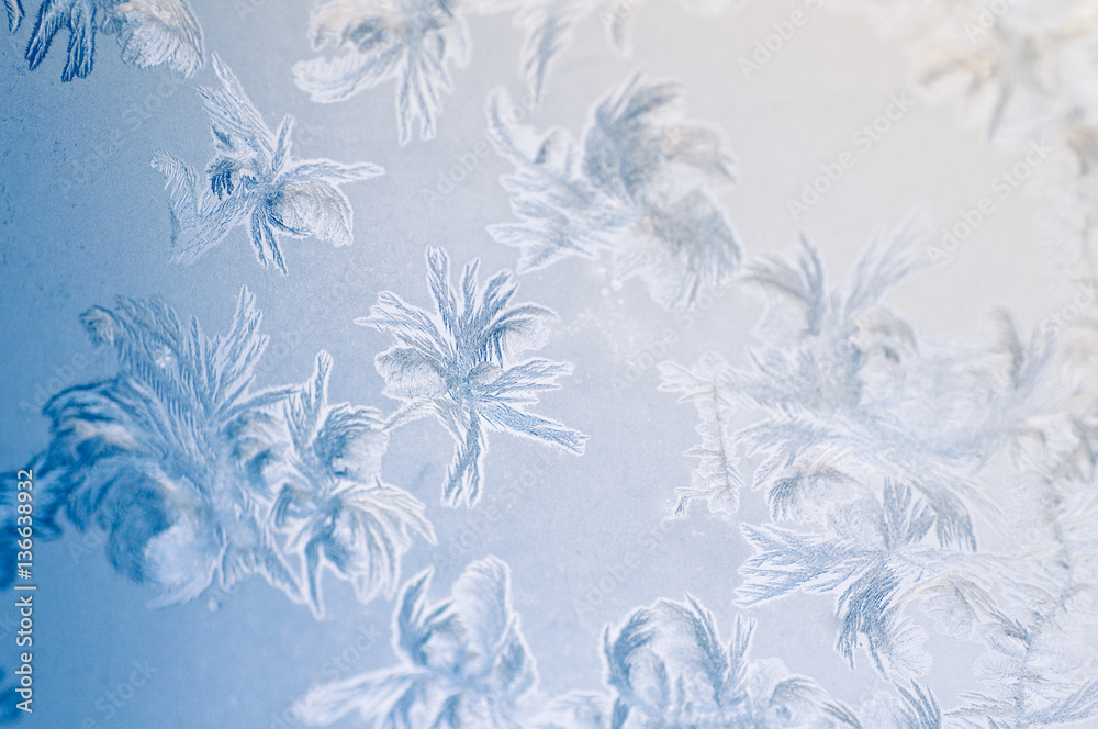 Frosty winter background photo of ice buildup on a window Frosty winter background photo of ice buildup on a window
