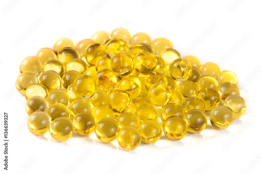 a bunch of fish oil capsules isolated on white background a bunch of fish oil capsules isolated on white background