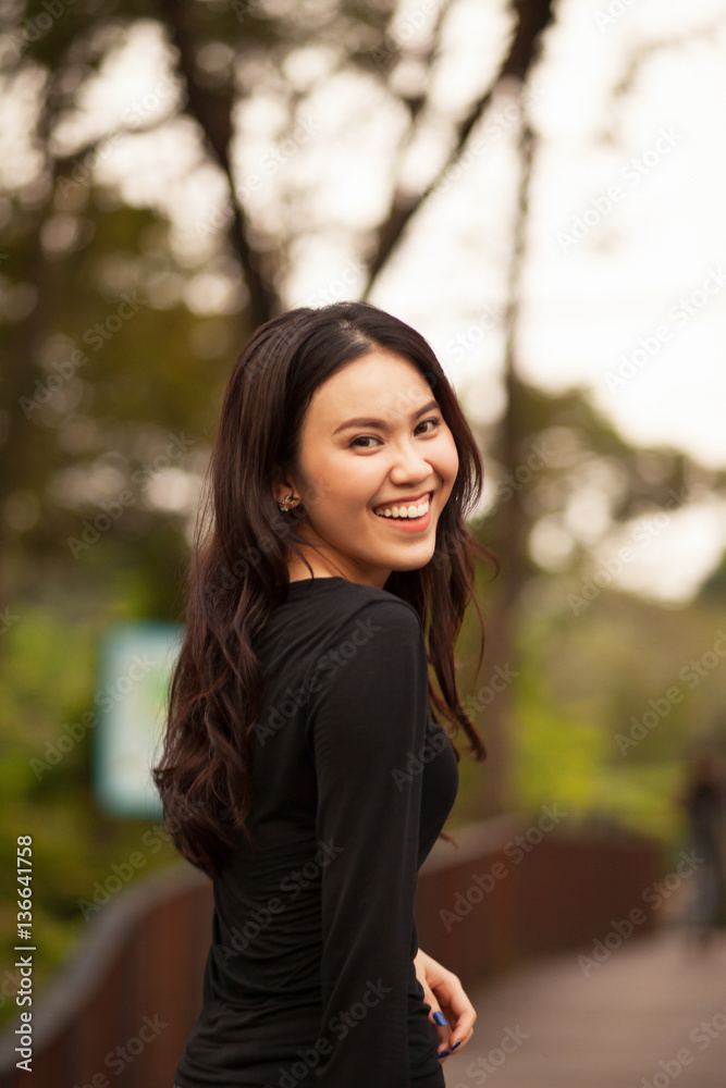 Thai pretty girl jumping and waving hair with a moment happiness. Thai pretty girl jumping and waving hair with a moment happiness.