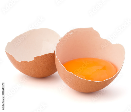 Broken egg in eggshell half isolated on white background cutout