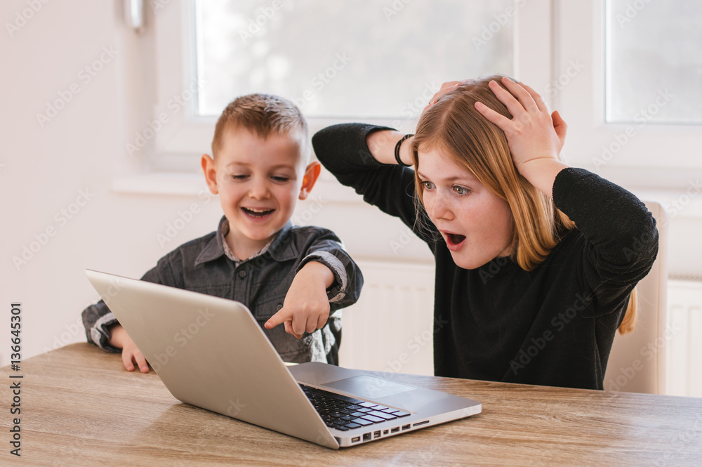 © bnenin - Lovely children watching a movie on their laptop at home © bnenin - Lovely children watching a movie on their laptop at home