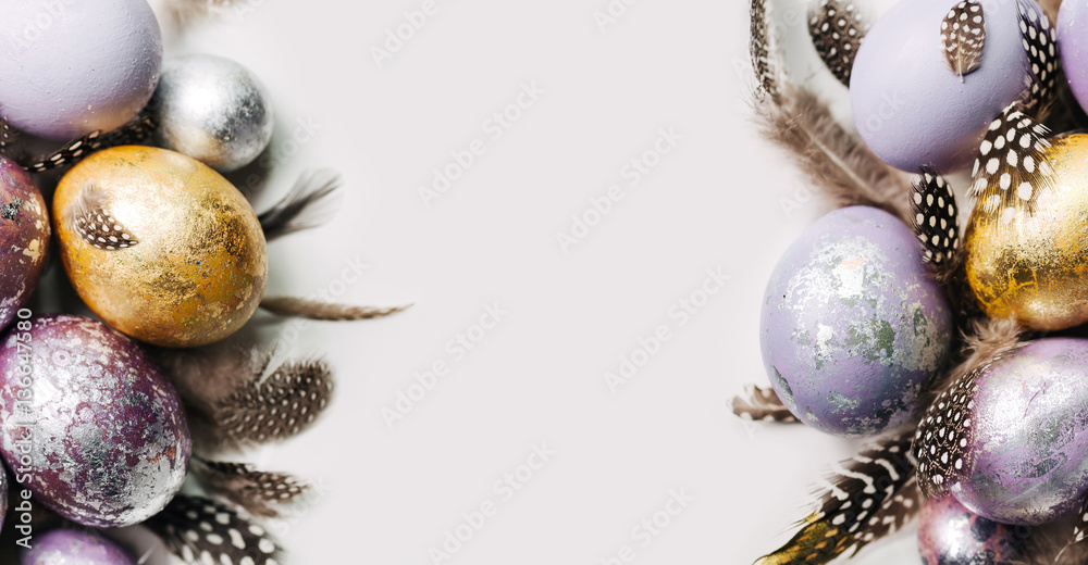 Gold and silver Easter eggs with copy space. Holiday background Stock