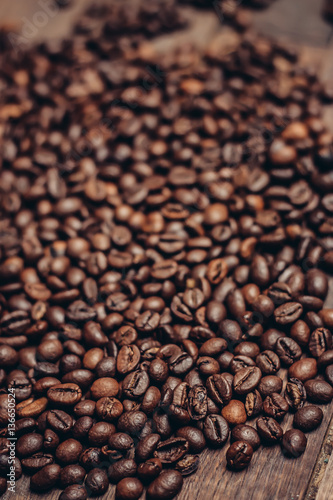 scattered coffee beans wooden table