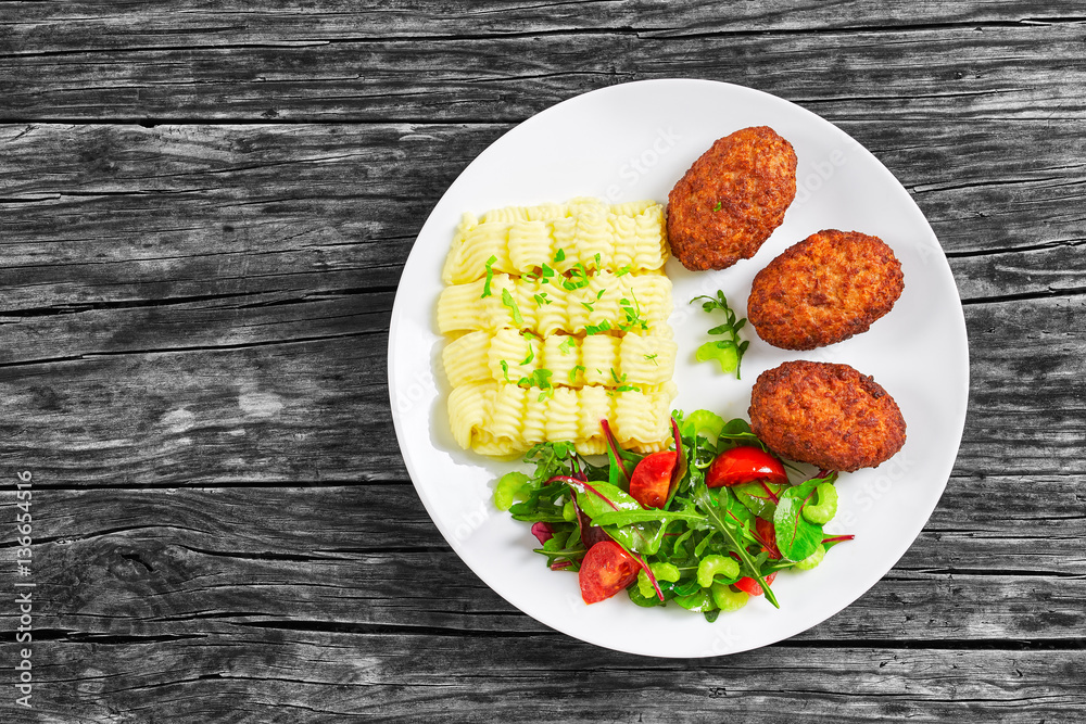 delicious mashed potatoes with juicy meat cutlets