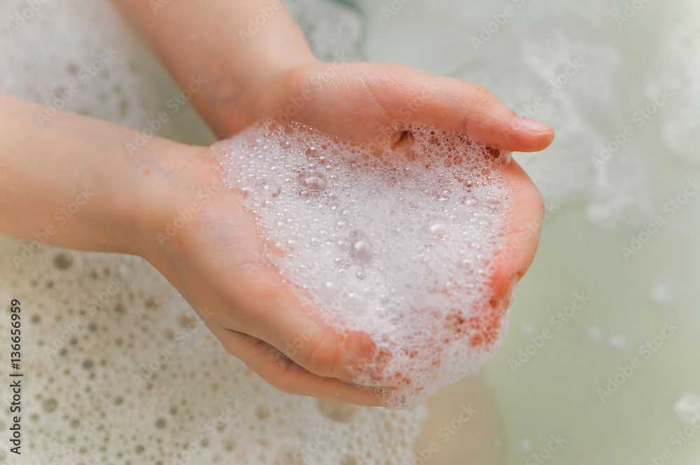 Fototapeta premium soap foam with bubble in a hands