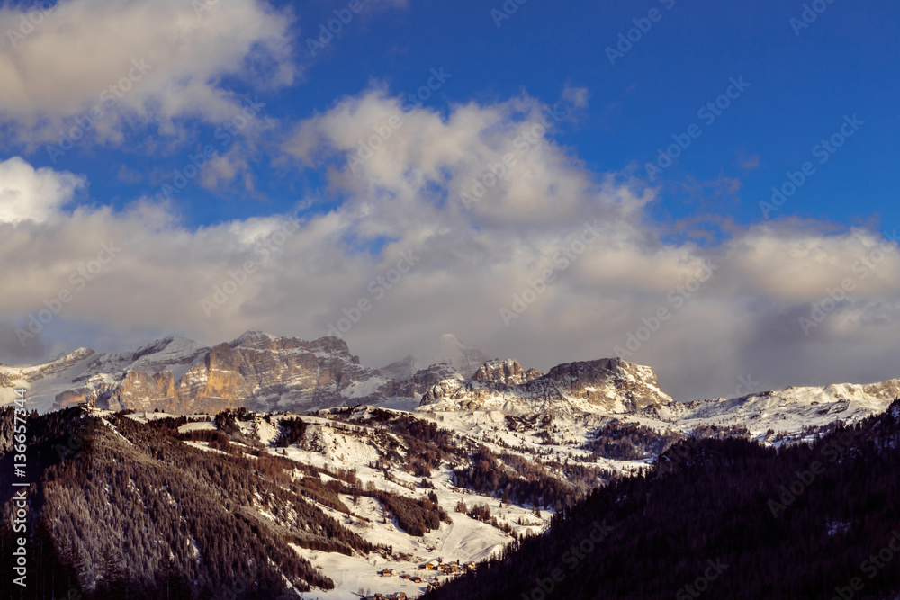 Fototapeta premium wind and cold on a road in a winter evening in the italian dolom