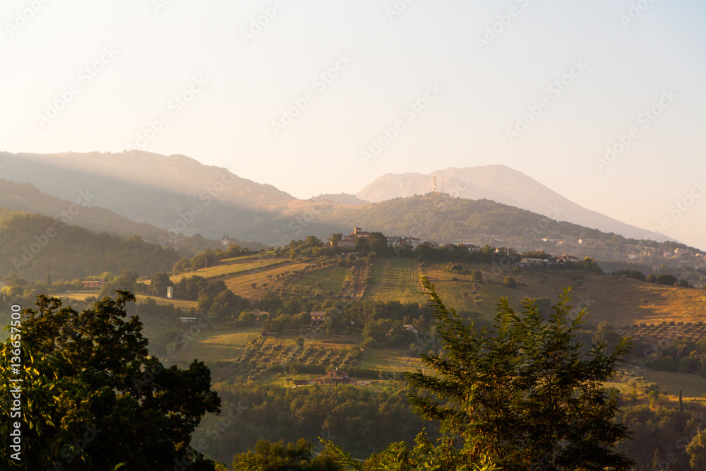 Green Italian hills early summer morning.