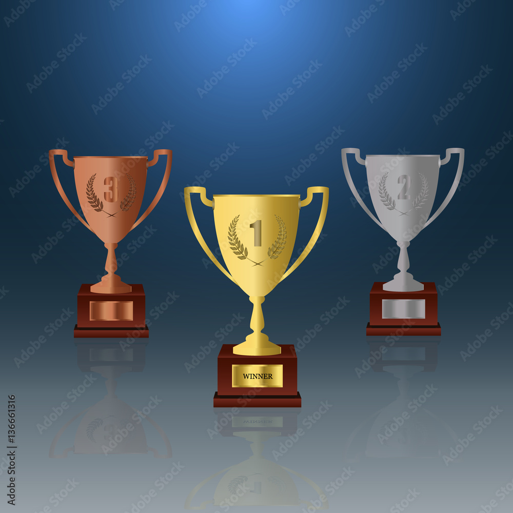 Winners podium with gold, silver and bronze cups. Winners podium with gold, silver and bronze cups.