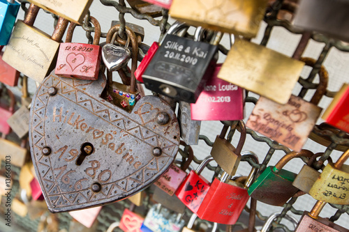 Thousands of love locks which sweethearts lock to the Hohenzollern Bridge to symbolize their love in Koln, Germany photo