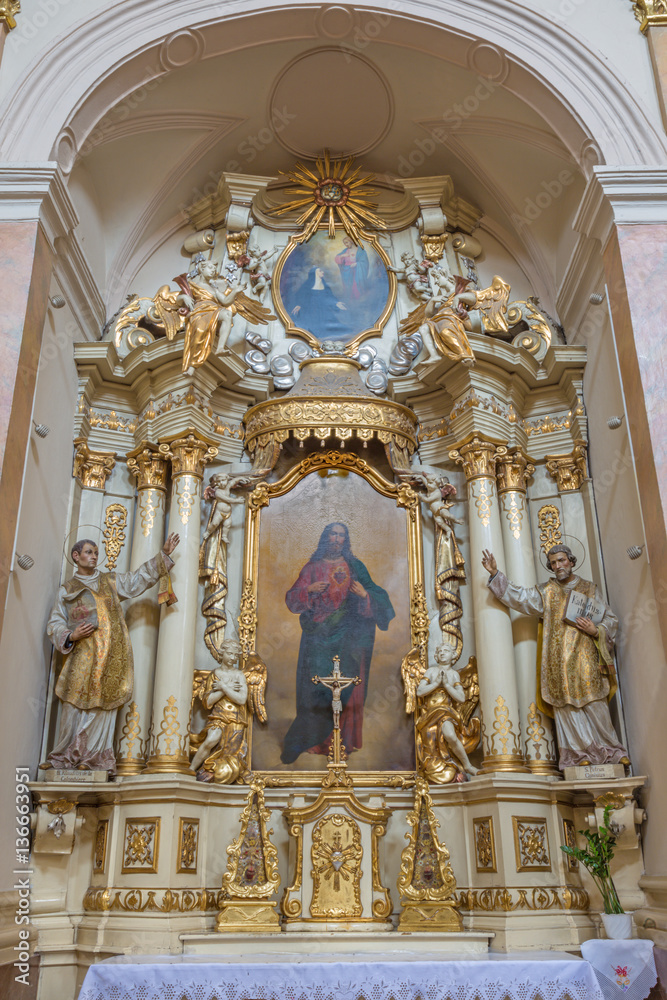TRNAVA, SLOVAKIA - MARCH 3, 2014: The side baroque altar in Jesuits church from 18. cent.