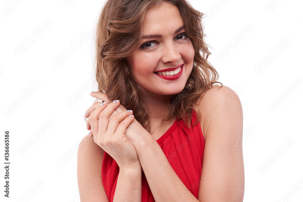 Fototapeta premium Charming girl holding hands together while posing at the camera