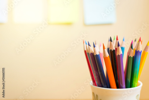 Colour pencils with  notepads on clear background