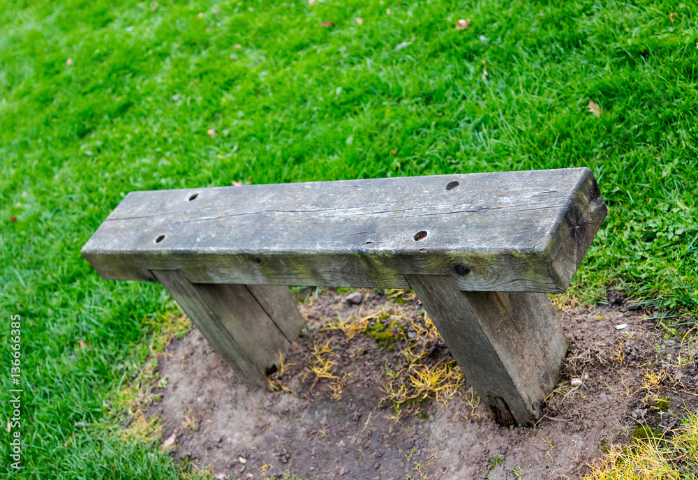 Wooden bench at hiking trail for rest and taking break Wooden bench at hiking trail for rest and taking break