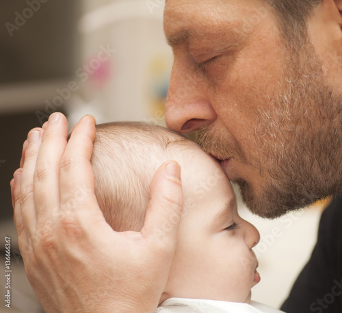 Father kissing his baby
