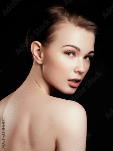 Beauty, spa. Attractive woman with beautiful face. Beautiful girl with daily makeup, youth and skin care concept. Woman beauty face portrait isolated on black with healthy skin. Face with perfect skin