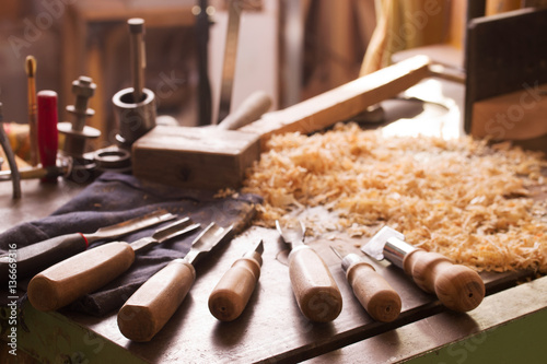 Carpenter tools on wood table background. Top view. Copy space