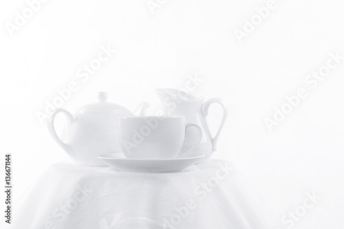 white cup, milk jug and a teapot © Rauf Kerimov