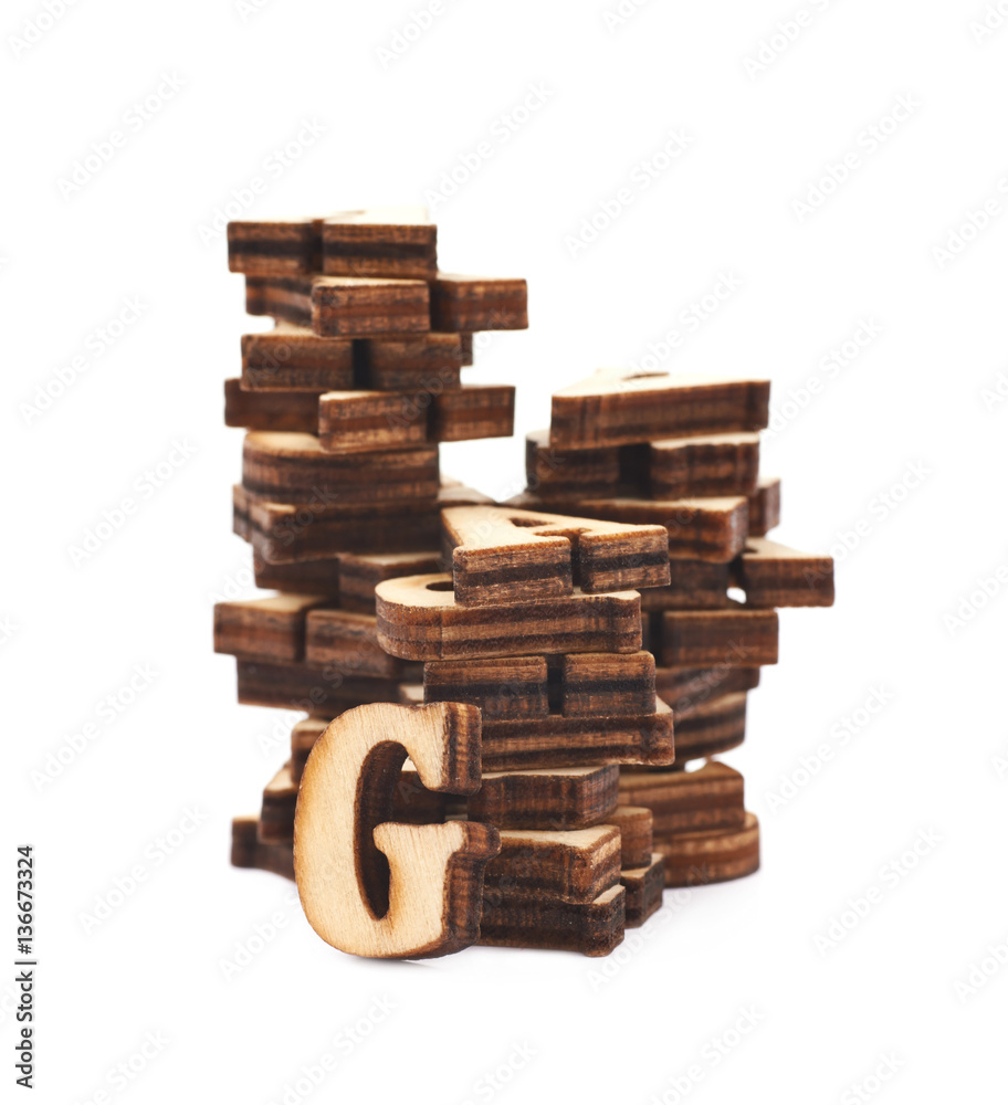 Pile of wood carved letters isolated Pile of wood carved letters isolated