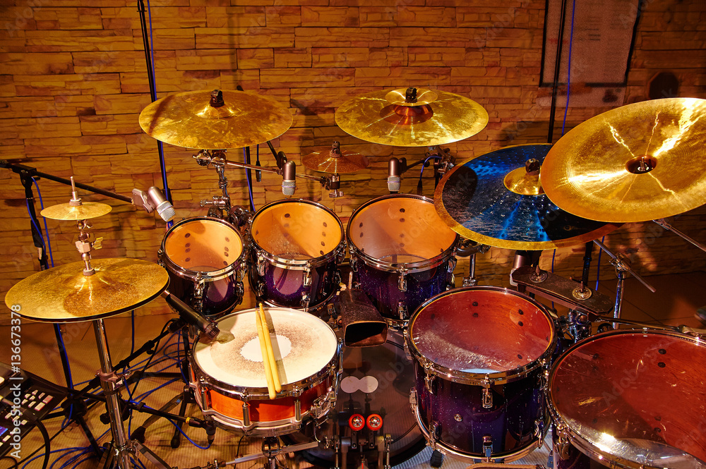 Fototapeta premium drum set with two wooden drumsticks on it