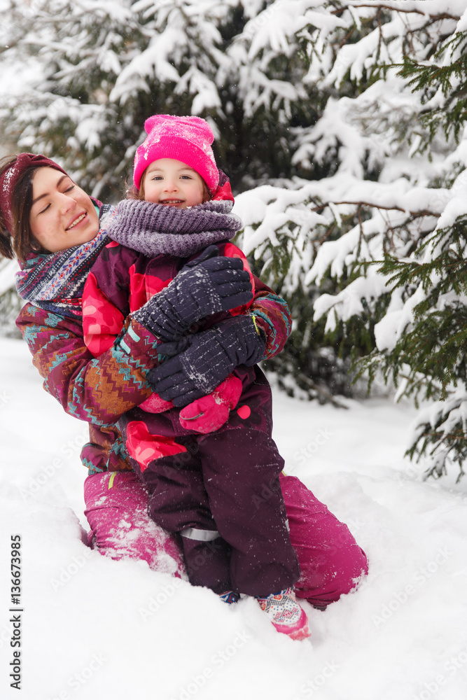 Beautiful brunette with little girl