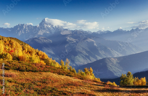 Autumn landscape and snow-capped mountain peaks. View of the mou © standret
