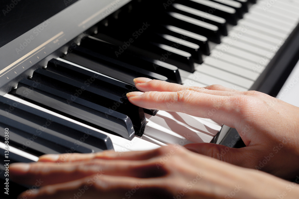 Obraz premium Playing Piano. close up
