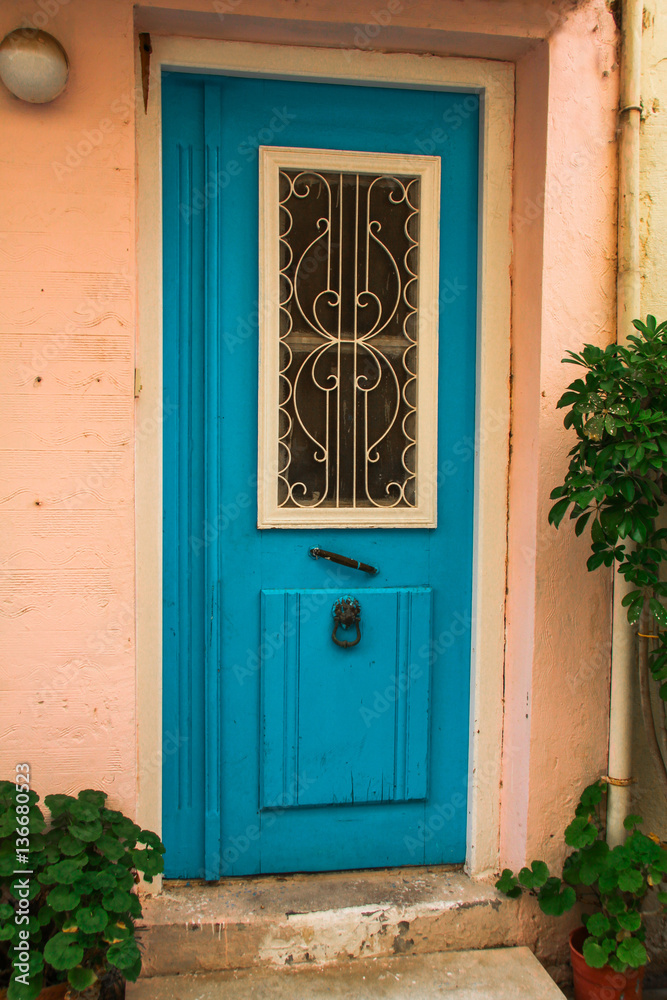 old blue wooden vintage painted door of greek island, Crete, Greece, traditional colorful facade