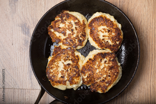 cheese pancakes in a frying pan