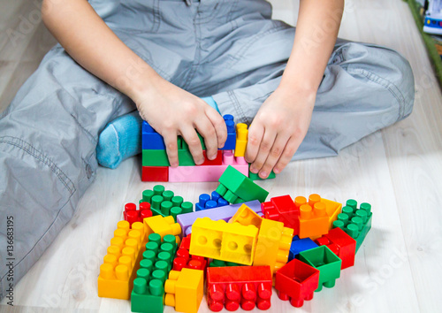 child builds a castle out of a constructor