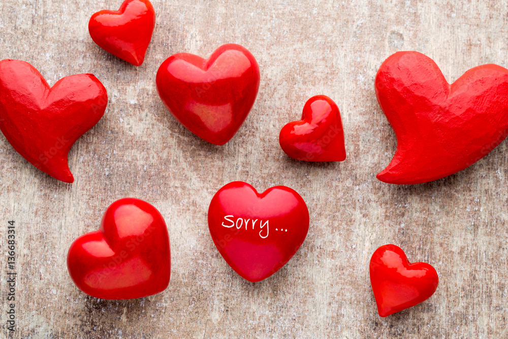 Obraz premium Red heart on the wooden background.