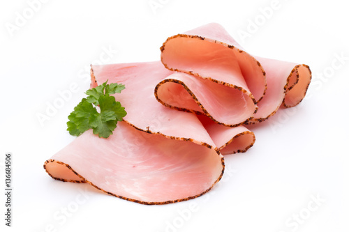 Thin slices of ham on white background.