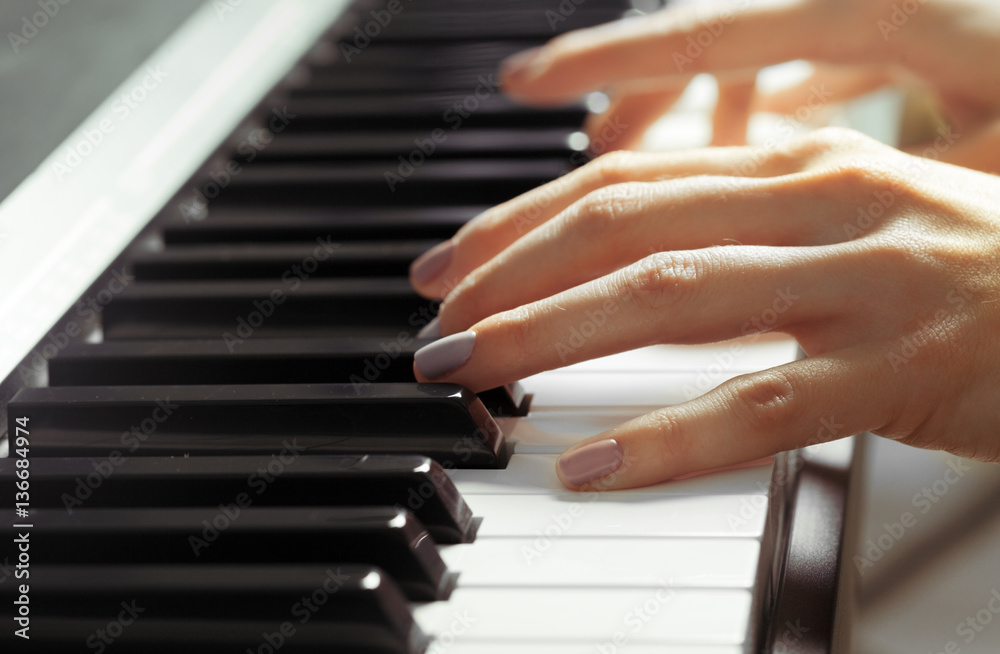Closeup of hands playing piano. Music and hobby concept Closeup of hands playing piano. Music and hobby concept