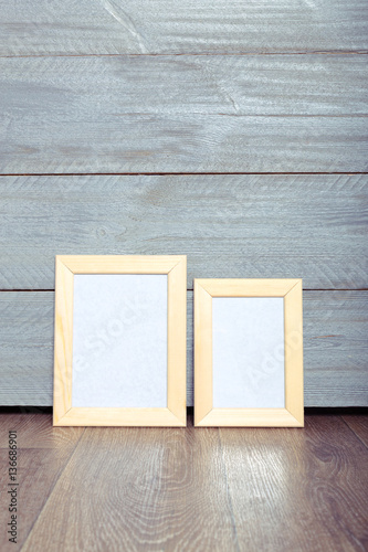  photo frames on the wooden wall