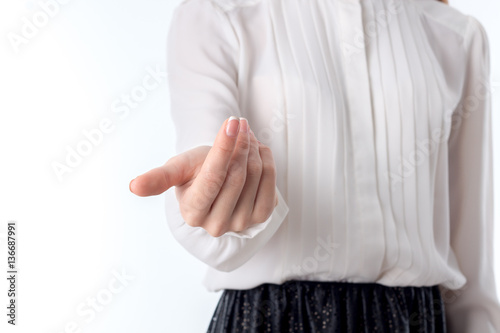 girl in white shirt stretched forth a hand isolated on  background