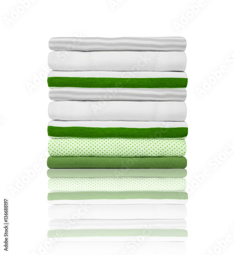new fresh clothes folded neatly in a pile isolated on a white ba