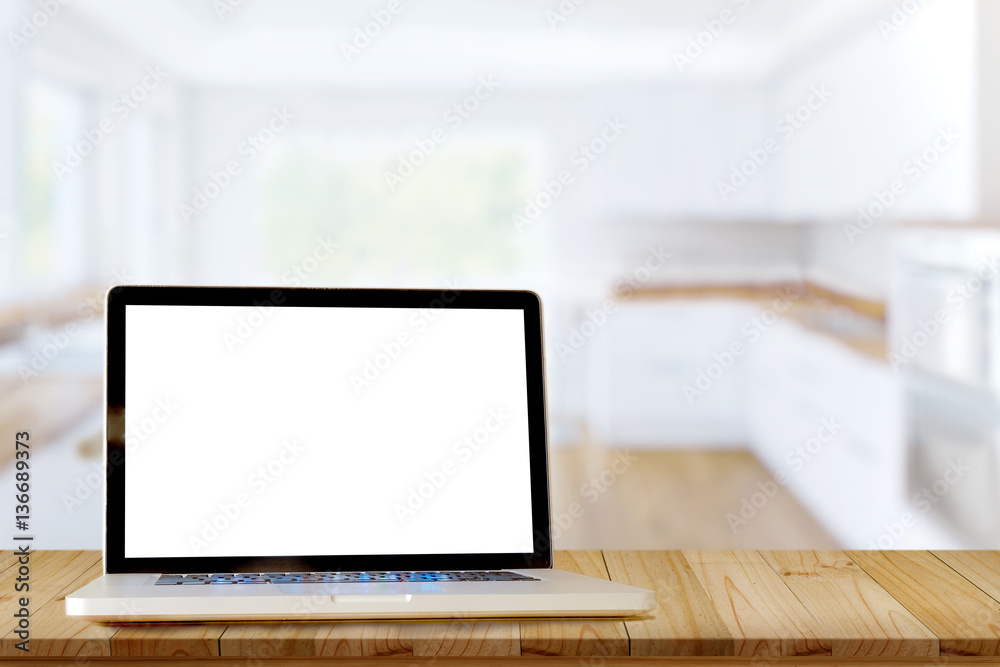 Smart Display Concept. Mock up laptop on wood table in modern kitchen room. for product montage display. Smart Display Concept. Mock up laptop on wood table in modern kitchen room. for product montage display.