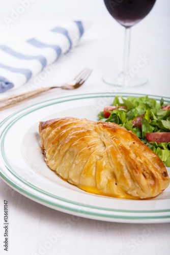 Chicken breast in french pastry with fresh salad